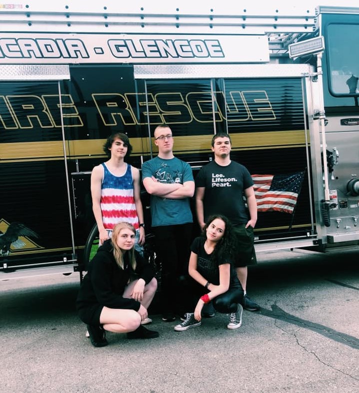Classic band photo in front of a firetruck