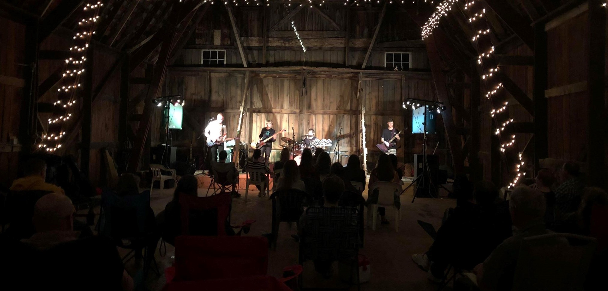 TTKH performing in a barn