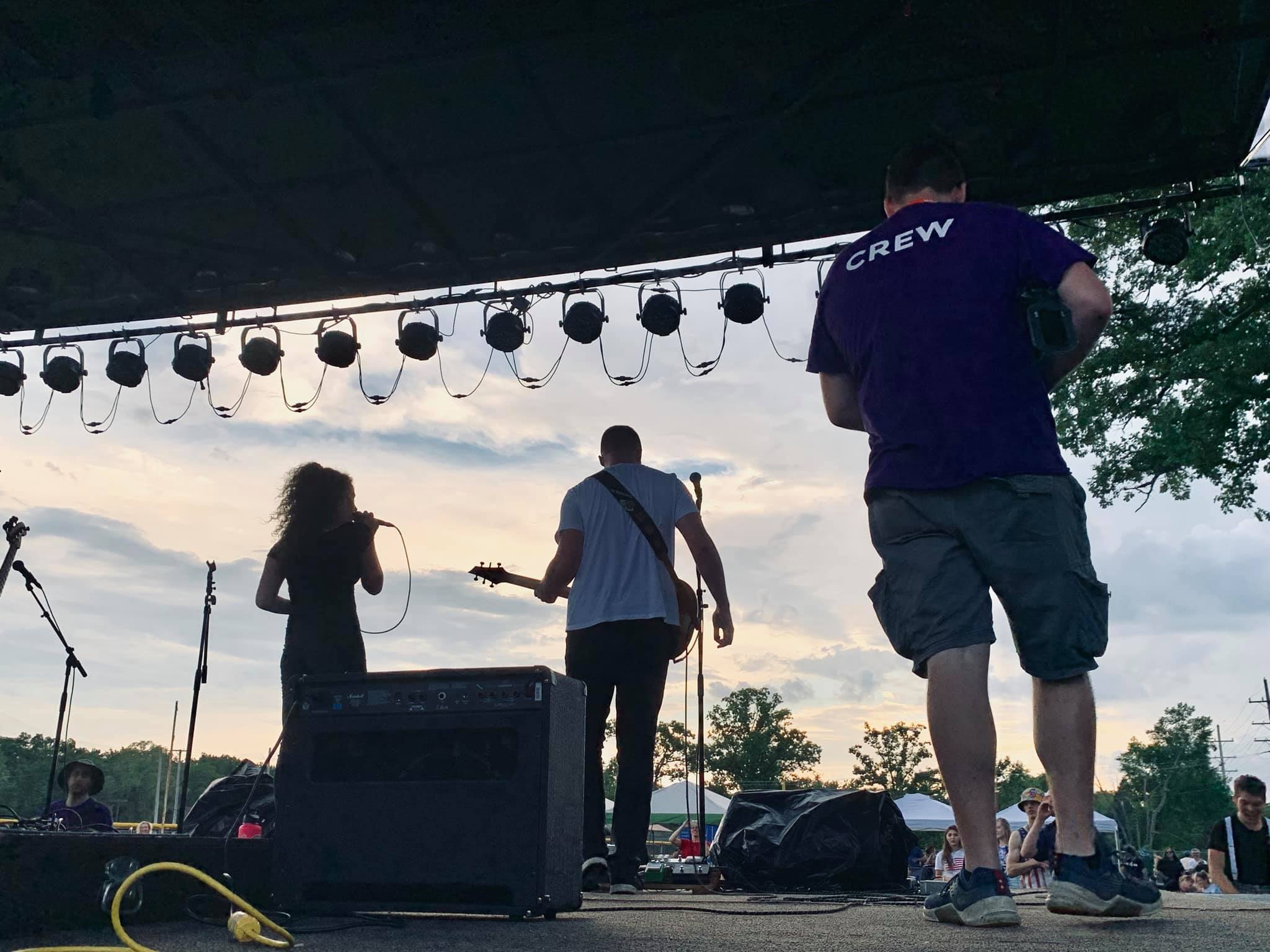 Zach and Abby on stage at the Bitter Jester Music Festival 
                finals